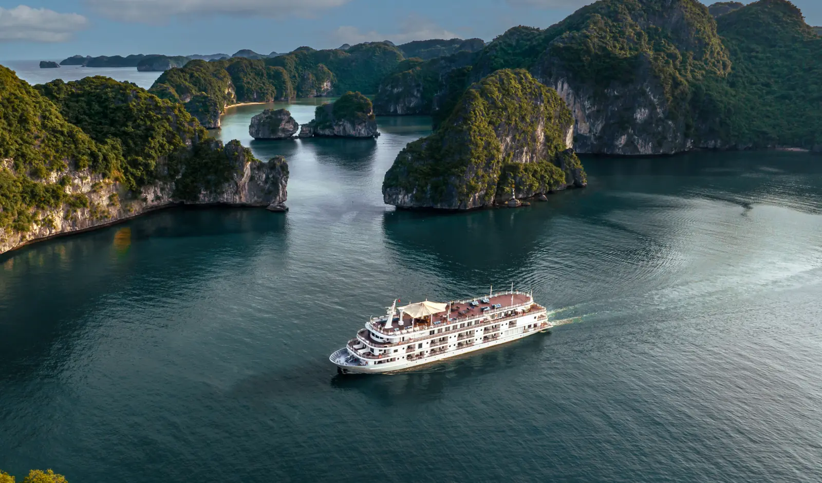 Ambassador Signature sailing between the karsts of Lan Ha Bay, seen from above