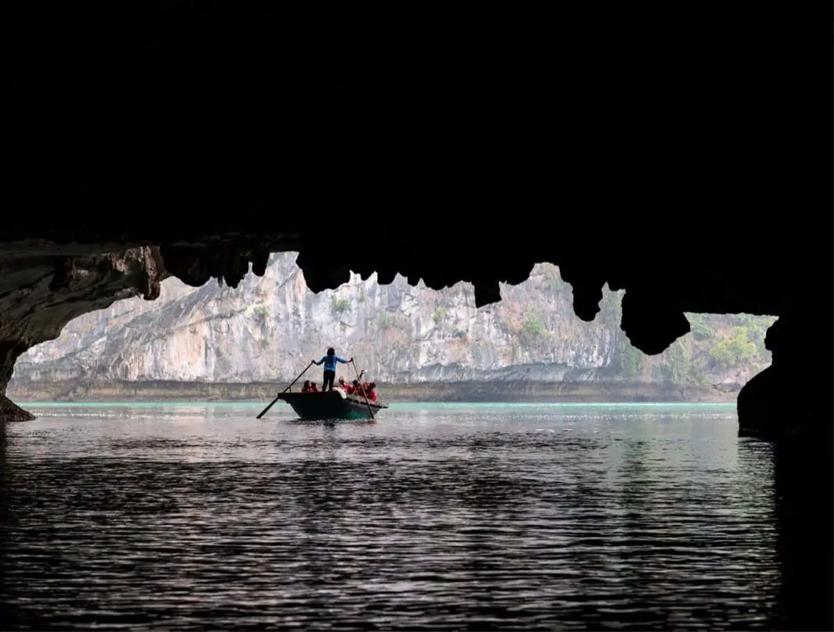 Bamboo boat passing through the Dark & Bright Cave