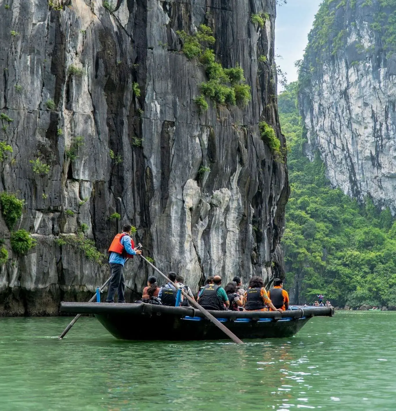 Bamboo boat rowed by locals