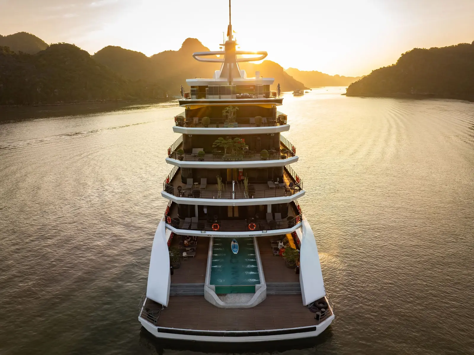 The stern of Diana Cruise with its pool at sunset