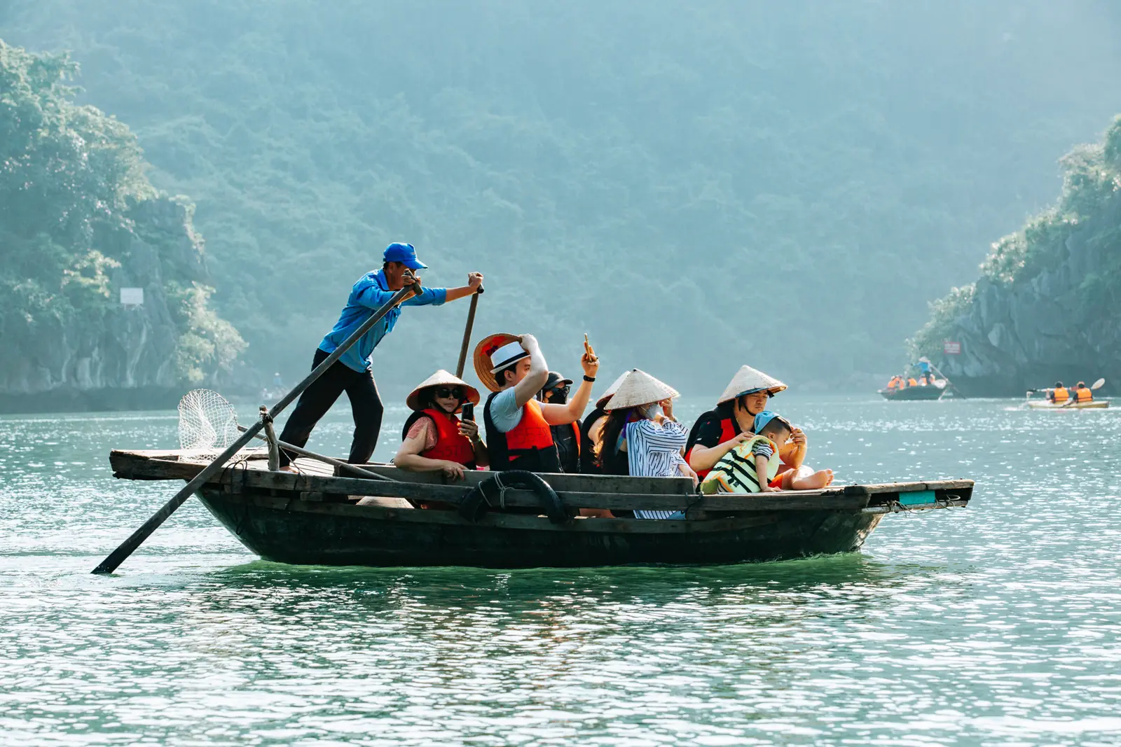 Bamboo boat rowed by a local through Lan Ha Bay