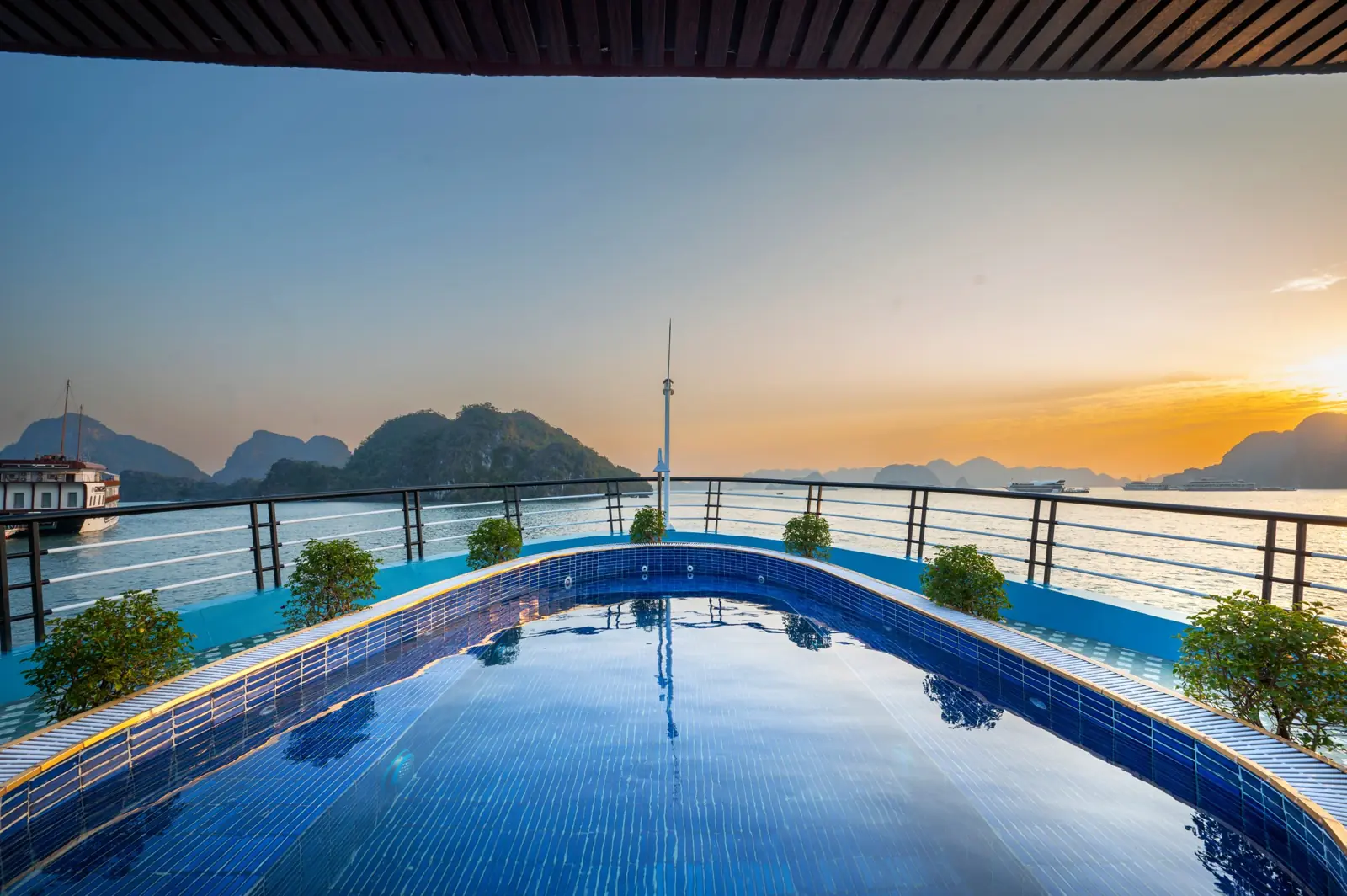 Pool on the deck of Dragonbay Premium Cruise at sunset