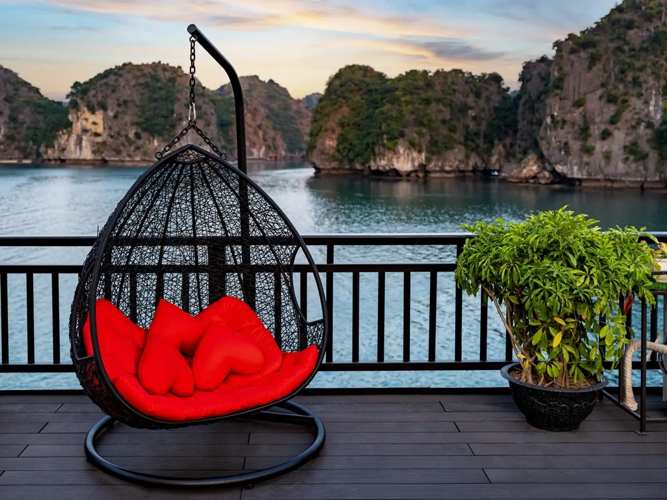 Hanging chair on deck facing the karsts