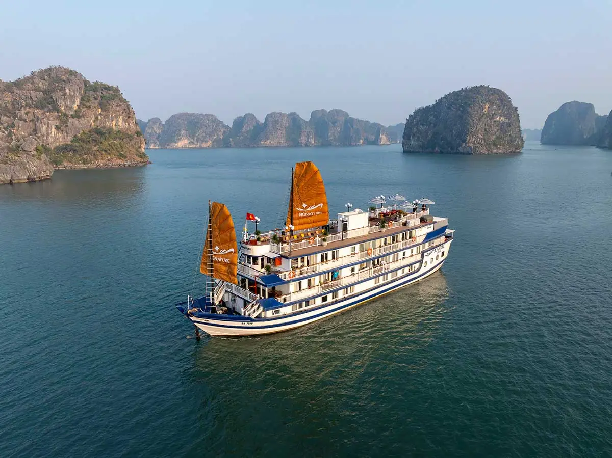 Signature Cruise sailing past limestone islands