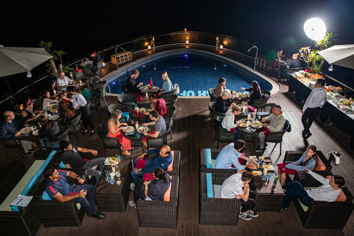 Dinner by the pool under the night sky