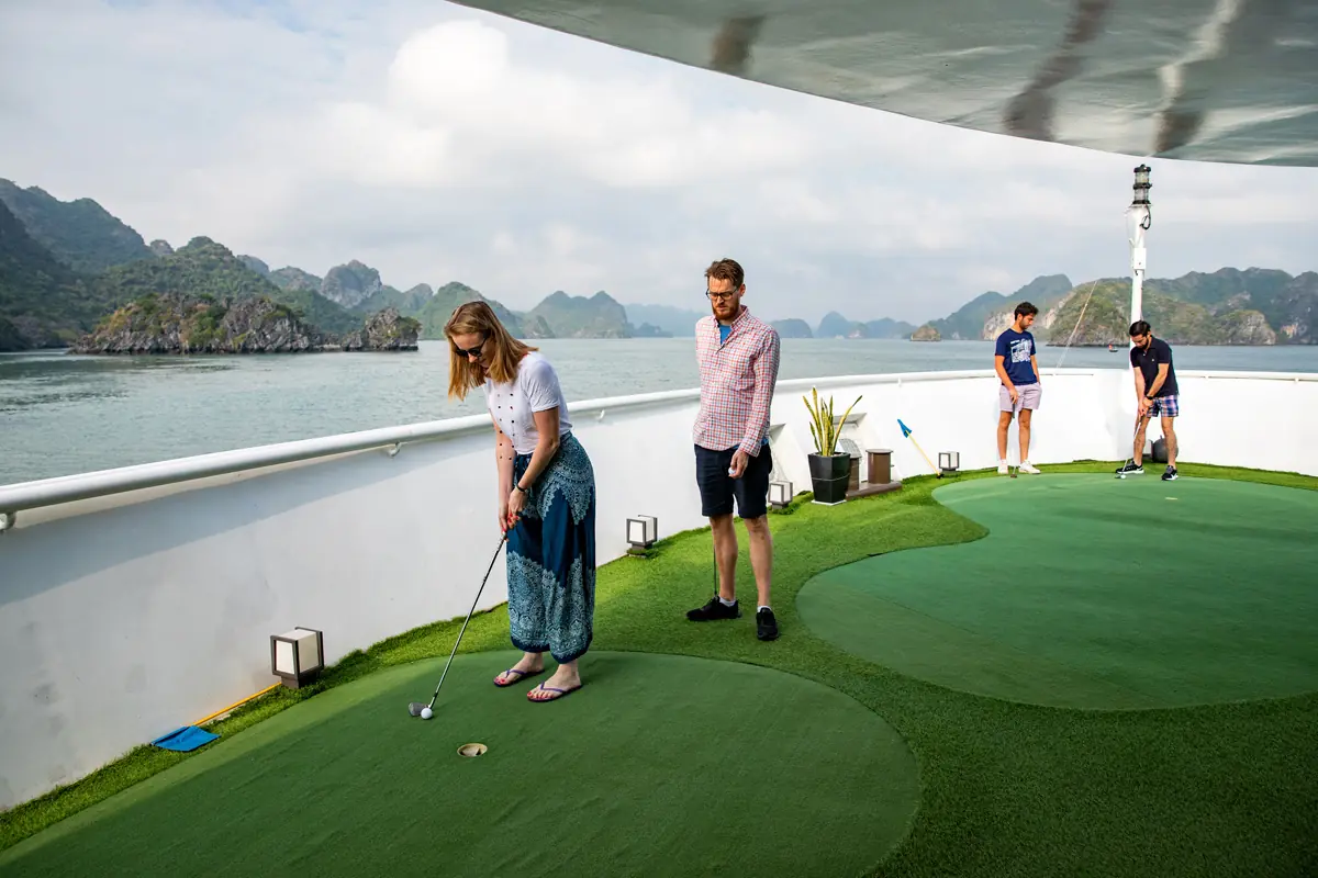 Guests on the mini golf green on deck