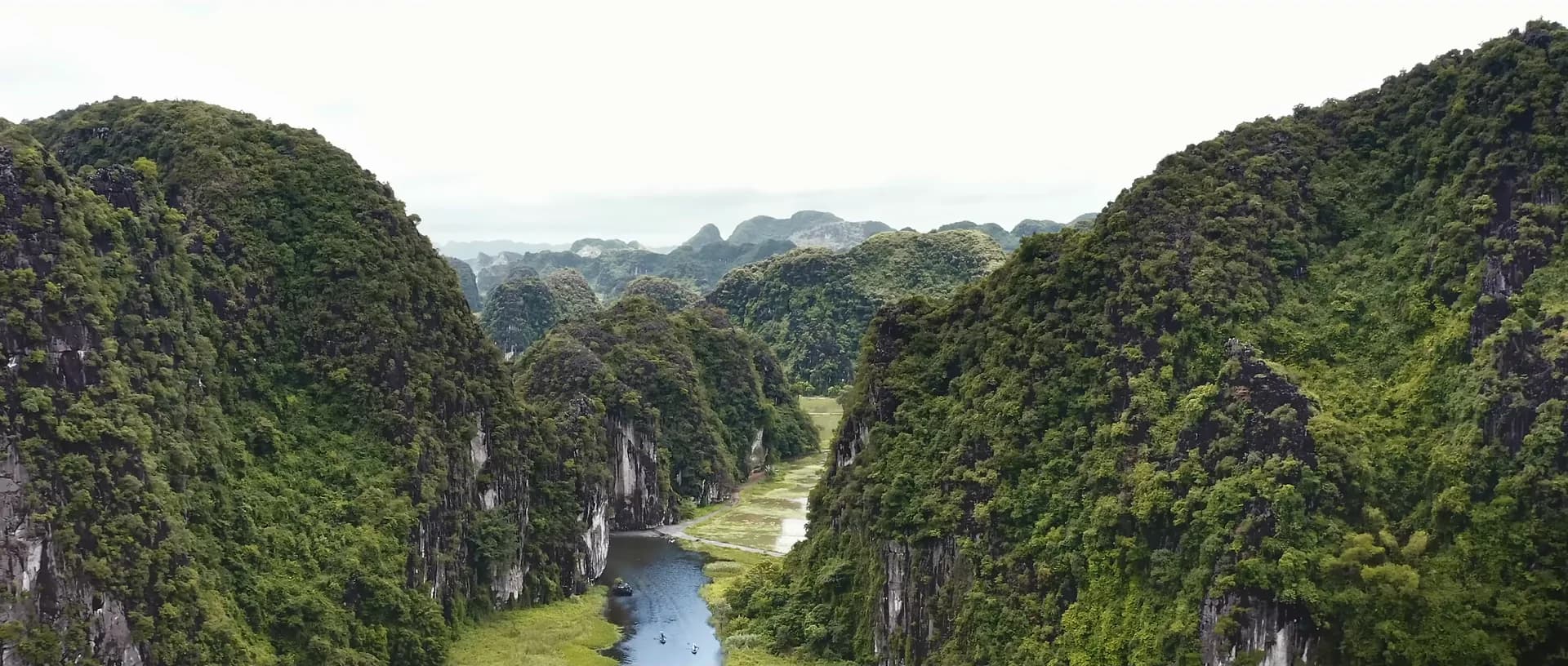 Green limestone peaks above the river at Trang An, Ninh Binh