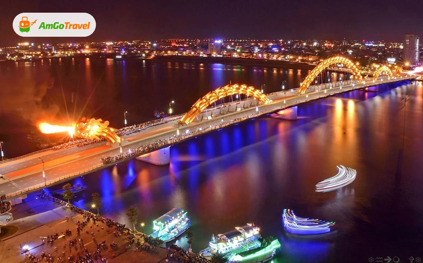 Dragon Bridge lit up over the Han River at night, Da Nang