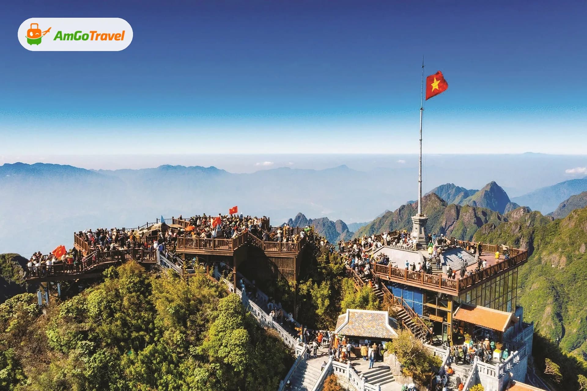 Visitors at Fansipan summit flag above clouds