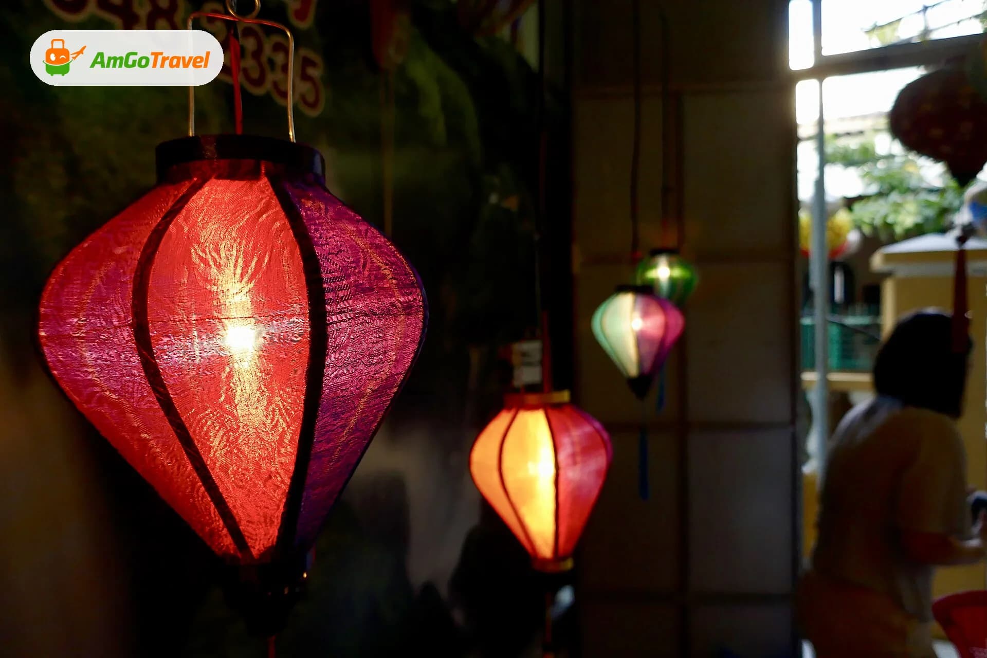 Handmade silk lanterns glowing in Hoi An