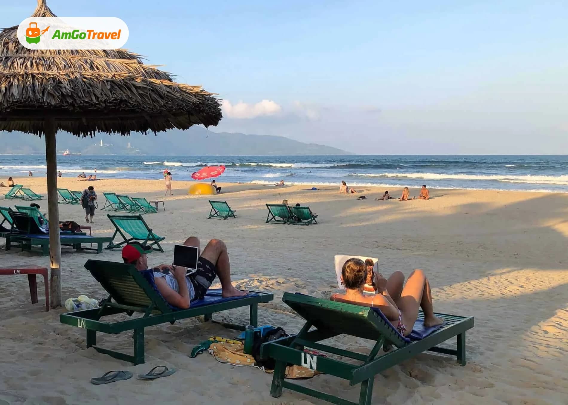 Sunbathers on loungers on a Da Nang beach