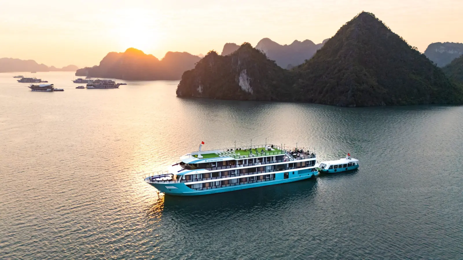 Dragonbay Premium Cruise sailing past the karsts at sunset