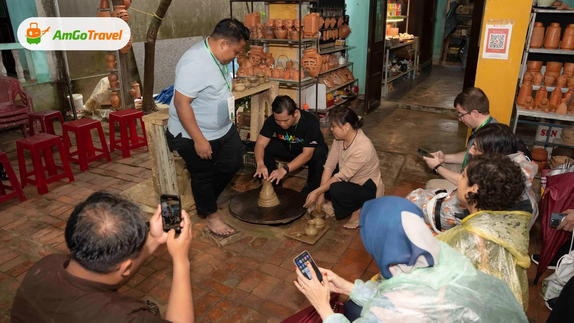 Visitors trying pottery wheel in Thanh Ha village