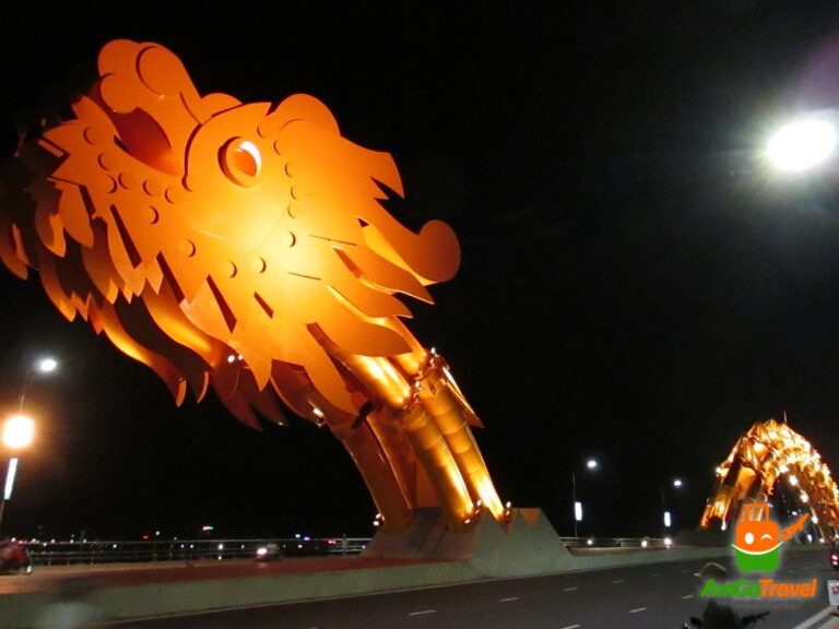 Da Nang by night tour: The Dragon Bridge breathing fire at night, Da Nang