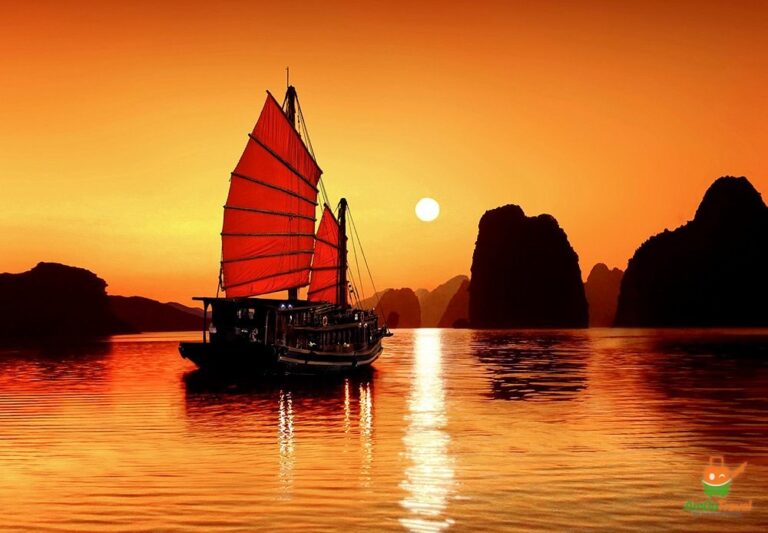 Junk boat at sunset in Ha Long Bay