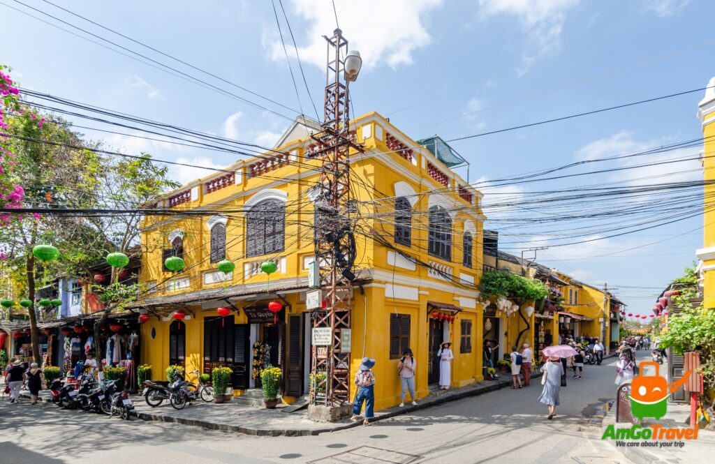 Yellow merchant houses on a street in Hoi An Ancient Town