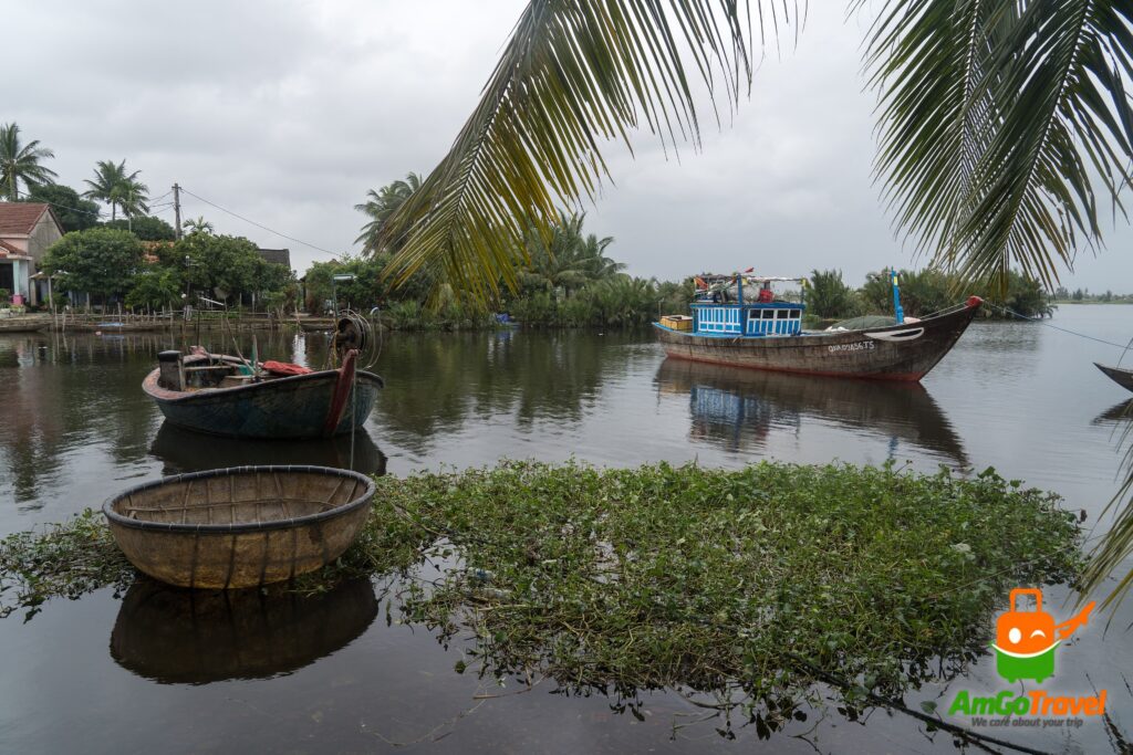 Fishing boats among the water palms near Hoi An
