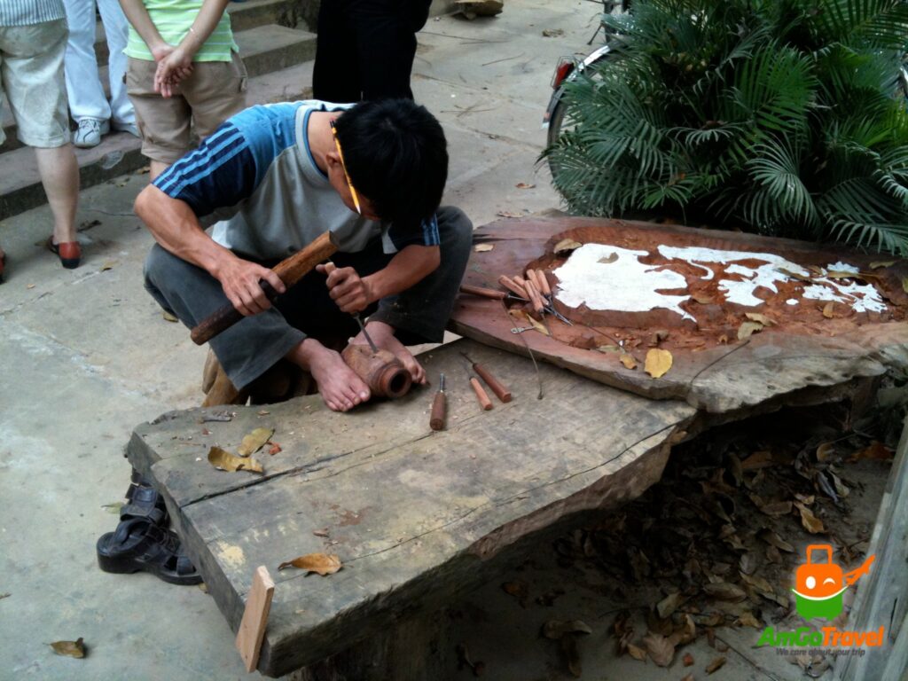 Wood carver at work in Kim Bong Carpentry Village, Hoi An