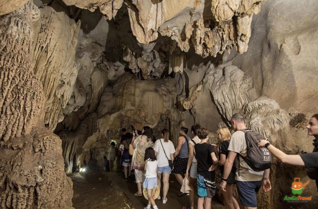 Guests visiting a cave with La Regina Grand Cruise