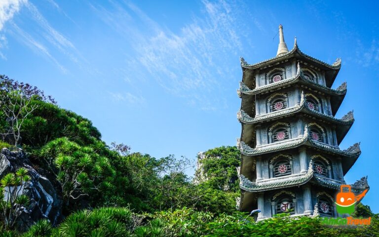 Marble Mountains sunset tour: Pagoda tower on the Marble Mountains under a blue sky