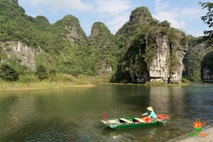 Rowing boats among the karst peaks of Trang An, Ninh Binh